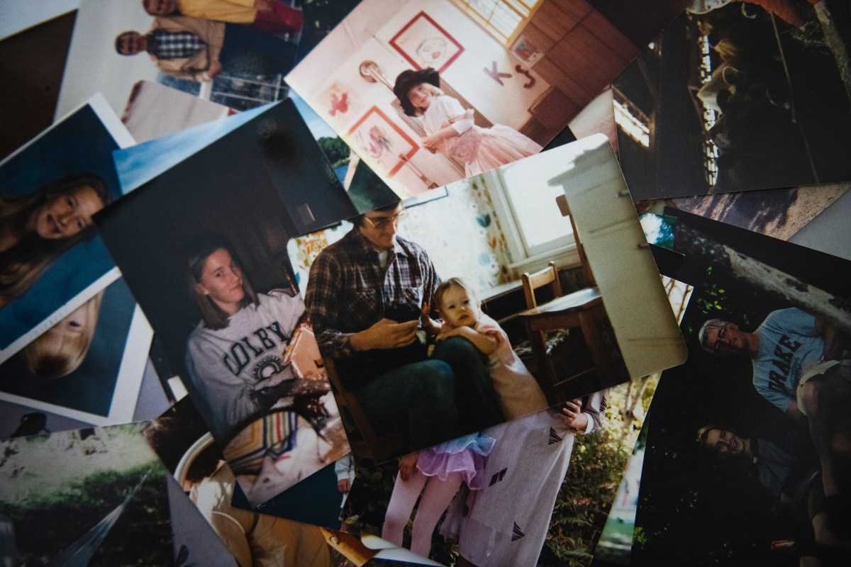 Sarah Corrie sifts through old photos of her sister Rachel at home in Olympia, WA July 10, 2022. Kholood Eid for The Intercept