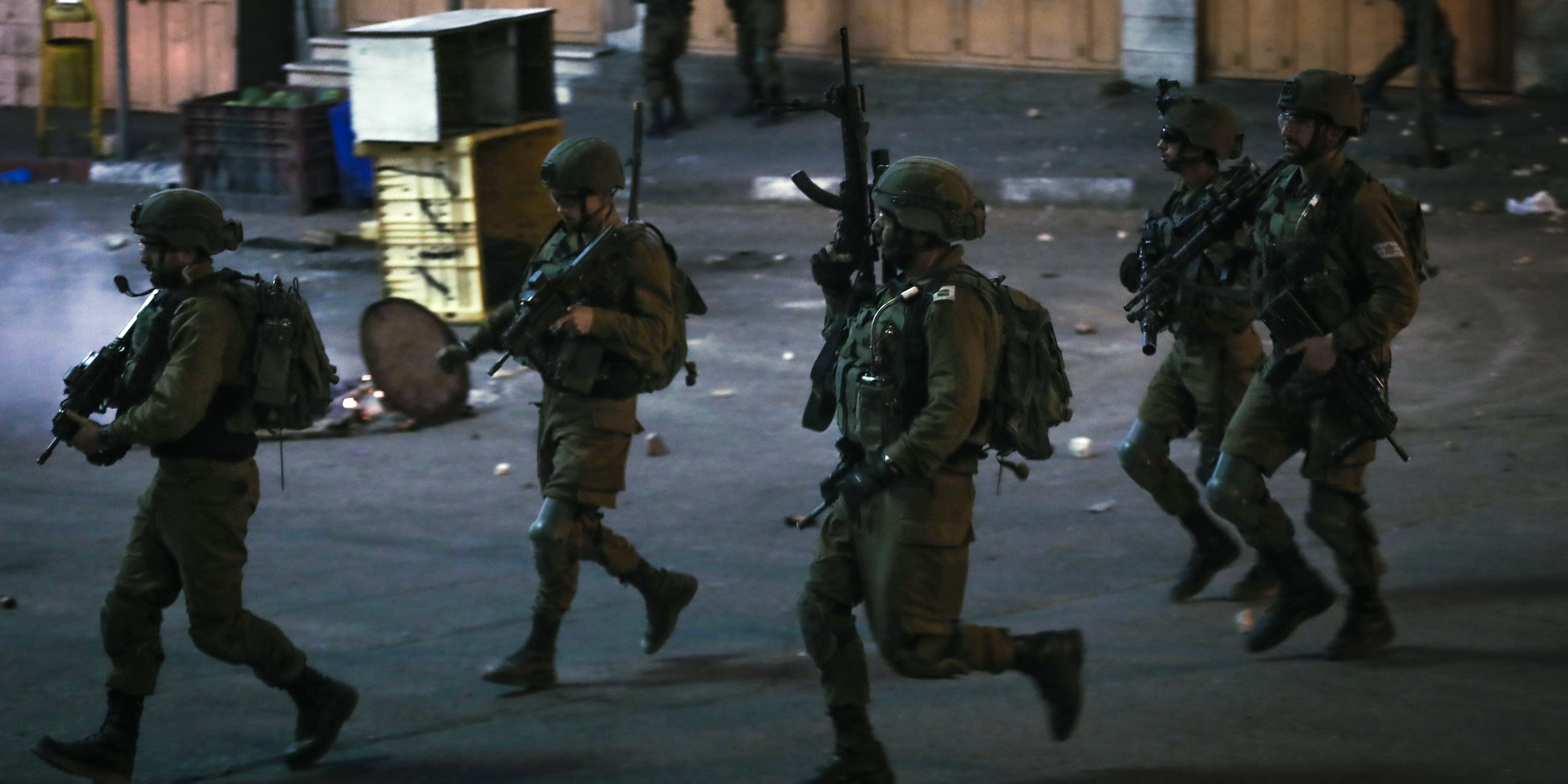 Israeli soldiers are seen during an anti-Israel protest in the West Bank city of Hebron, on May 14, 2021. Tension between Israelis and Palestinians has been flaring up over the past few days amid the escalating violence in East Jerusalem between Palestinian demonstrators and Israeli forces. (Photo by Mamoun Wazwaz/Xinhua via Getty Images (Xinhua/Mamoun Wazwaz via Getty Images)