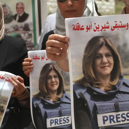 NABLUS, WEST BANK, PALESTINE - 2022/05/14: Palestinian students hold pictures of Al Jazeera reporter Shireen Abu Akleh during a protest condemning her murder at the Al-Quds Open University in the city of Nablus in the occupied West Bank. (Photo by Nasser Ishtayeh/SOPA Images/LightRocket via Getty Images)