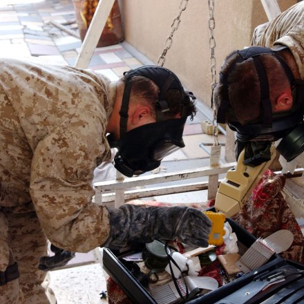 FALLUJAH, IRAQ - NOVEMBER 9. U.S Marines from the 1st U.S Marines Expeditionary Force, 1st Battalion, 3rd Marines Regiment, Bravo Company confiscate an house where to rest during the night as tyey carry the ground offensive in Fallujah on November 9, 2004. U.S. troops powered their way into the center of the insurgent stronghold of Fallujah on Tuesday, overwhelming small bands of guerrillas with massive force, searching homes along the city's deserted, narrow passageways and using loudspeakers to try to goad militants onto the streets.(Photo by Marco Di Lauro/Getty Images)