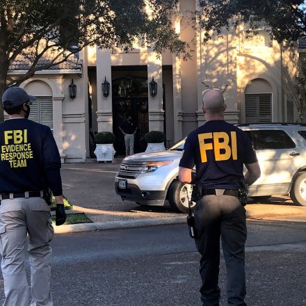 Federal agents search the home of U.S. Rep. Henry Cuellar in Laredo, Texas, on Wednesday, Jan. 19, 2022. (Valarie Gonzalez/The Monitor via AP)