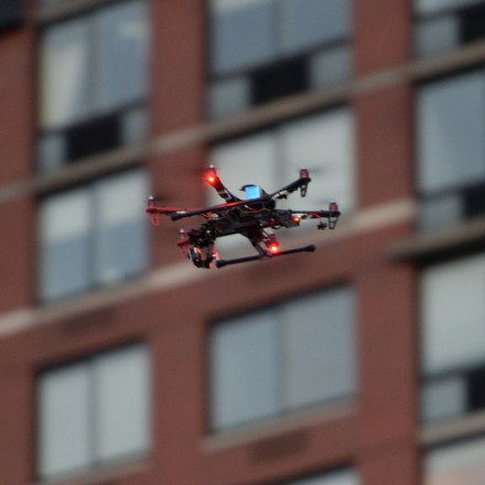 A quad-copter camera drone flies over crowds gathered to attend the "Diner En Blanc" held at Rockefeller Park in Battery Park City in New York, NY, on August 25, 2014. The annual event is the worlds only viral culinary event, a chic secret pop-up style picnic imported from France, where guests are only told of the location at the last minute and are required to dress entirely in elegant white, bring a picnic basket of food, fine china and silverware, white tablecloths, table and chairs.(Photo by Anthony Behar/Sipa USA)