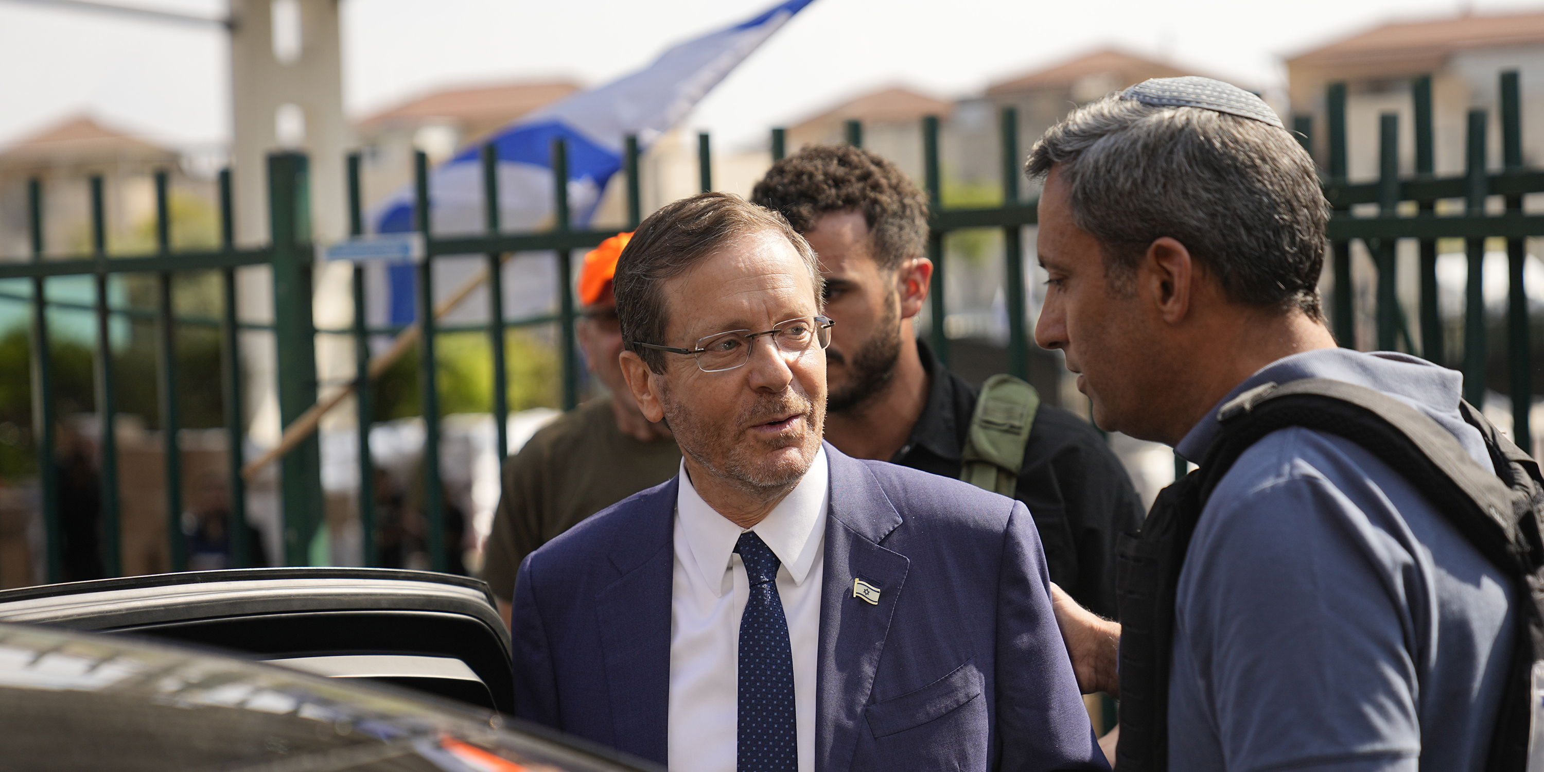 Israeli President Isaac Herzog, front left, visits Sderot, a town close to the Gaza Strip, on Wednesday, Oct.11, 2023. (AP Photo/Ohad Zwigenberg)