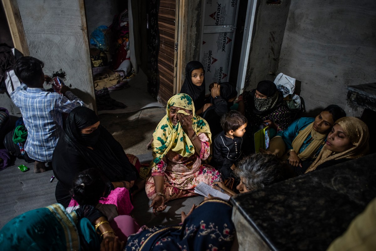 DELHI, INDIA - MARCH 01: An Indian Muslim woman cries in a makeshift camp as she narrates her ordeal in a riot-affected area on March 01, 2020 in New Delhi, India. At least 42 people have been killed, hundreds injured and property damaged in communal violence that erupted in Indias national capital this week over the controversial Citizenship Amendment Act as US President Donald Trump arrived in the country on his maiden visit. Human rights activists have moved to Indian and Delhi court amid accusations that the Delhi Police did not do enough to stop rioting and even helped mobs from the majority community.(Photo by Yawar Nazir/ Getty Images)