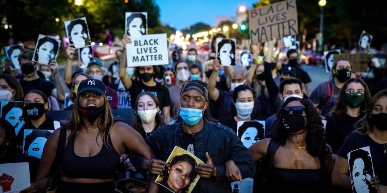 WASHINGTON, DC - SEPTEMBER 23: Demonstrators march along Constitution Avenue in protest following a Kentucky grand jury decision in the Breonna Taylor case on September 23, 2020 in Washington, DC. A Kentucky grand jury indicted one police officer involved in the shooting of Breonna Taylor with 3 counts of wanton endangerment. No officers were indicted on charges in connection to Taylor's death. (Photo by Drew Angerer/Getty Images)