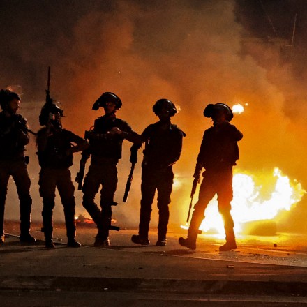 Israeli security forces clash with Palestinian protesters at the Hawara checkpoint, south of Nablus city, in the occupied West Bank on May 10, 2021. (Photo by JAAFAR ASHTIYEH / AFP) (Photo by JAAFAR ASHTIYEH/AFP via Getty Images)