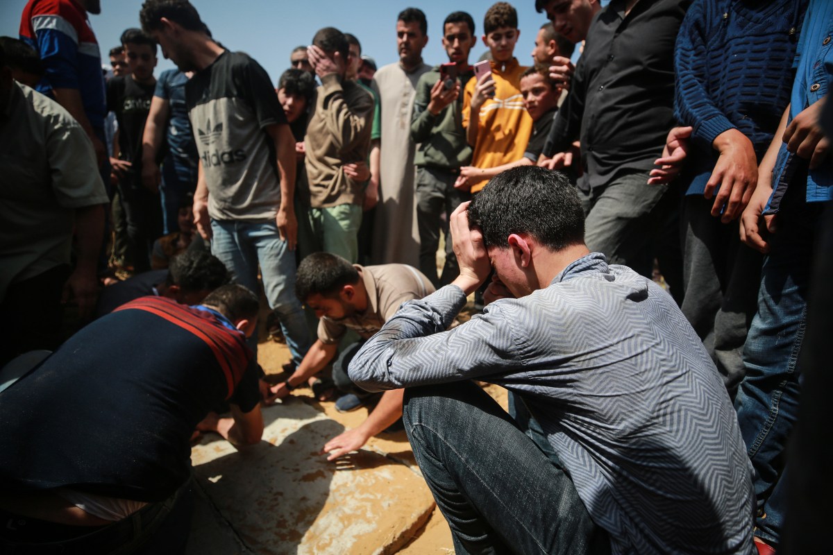 GAZA CITY, GAZA - MAY 11: People attend the funeral of Palestinian father Saber and his son Muhammed Suleyman who were killed in Israeli airstrike on Gaza Strip, in Jabalia refugee camp in Gaza City, Gaza on May 11, 2021. (Photo by Mustafa Hassona/Anadolu Agency via Getty Images)