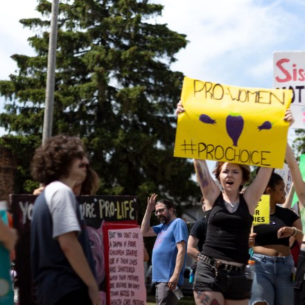 TOLEDO, OHIO, UNITED STATES - 2022/06/25: Counter protesters hold placards in favor of abortion and against an anti-abortion prayer circle. Protesters came to disrupt a prayer rally praying to end abortion. (Photo by Stephen Zenner/SOPA Images/LightRocket via Getty Images)