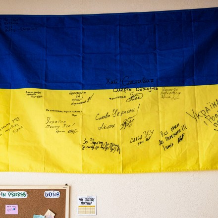 KYIV, UKRAINE - OCTOBER 07: A Ukrainian flag hangs on the Centre for Civil Liberty office on as staff celebrate October 7, 2022 in Kyiv, Ukraine. The Ukrainian human rights organization received the 2022 Nobel Peace Prize along with human rights advocate Ales Bialiatski from Belarus, and the Russian human rights organization Memorial, which was shut down earlier this year. (Photo by Ed Ram/Getty Images)