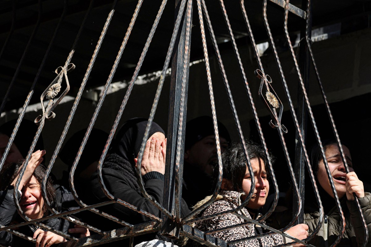 The sisters and relatives of Palestinian teenager Hamza Amjad al-Ashqar, shot dead by Israeli troops in the occupied West Bank city of Nablus the previous day, mourn during his funeral at the Askar refugee camp east of Nablus on February 7, 2023. - The Palestnian health ministry said the 17-year-old was killed by a bullet in the face during a raid on Nablus and the Israeli army said he had fired on soldiers. (Photo by Jaafar ASHTIYEH / AFP) (Photo by JAAFAR ASHTIYEH/AFP via Getty Images)