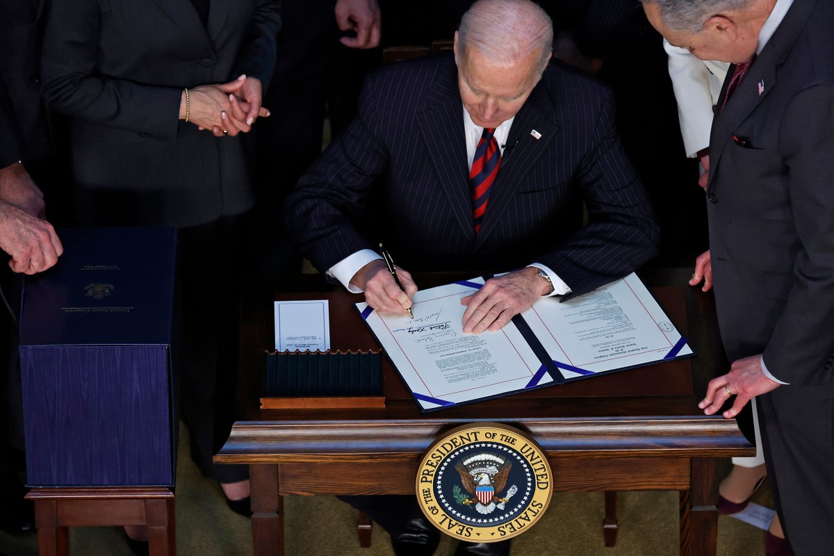 WASHINGTON, DC - MARCH 15: U.S. President Joe Biden signs the “Consolidated Appropriations Act" in the Indian Treaty Room in the Eisenhower Executive Office Building on March 15, 2022 in Washington, DC. Averting a looming government shutdown, the $1.5 trillion budget -- which includes $14 billion in humanitarian, military and economic assistance to Ukraine -- will fund the federal government through September 2022. (Photo by Chip Somodevilla/Getty Images)