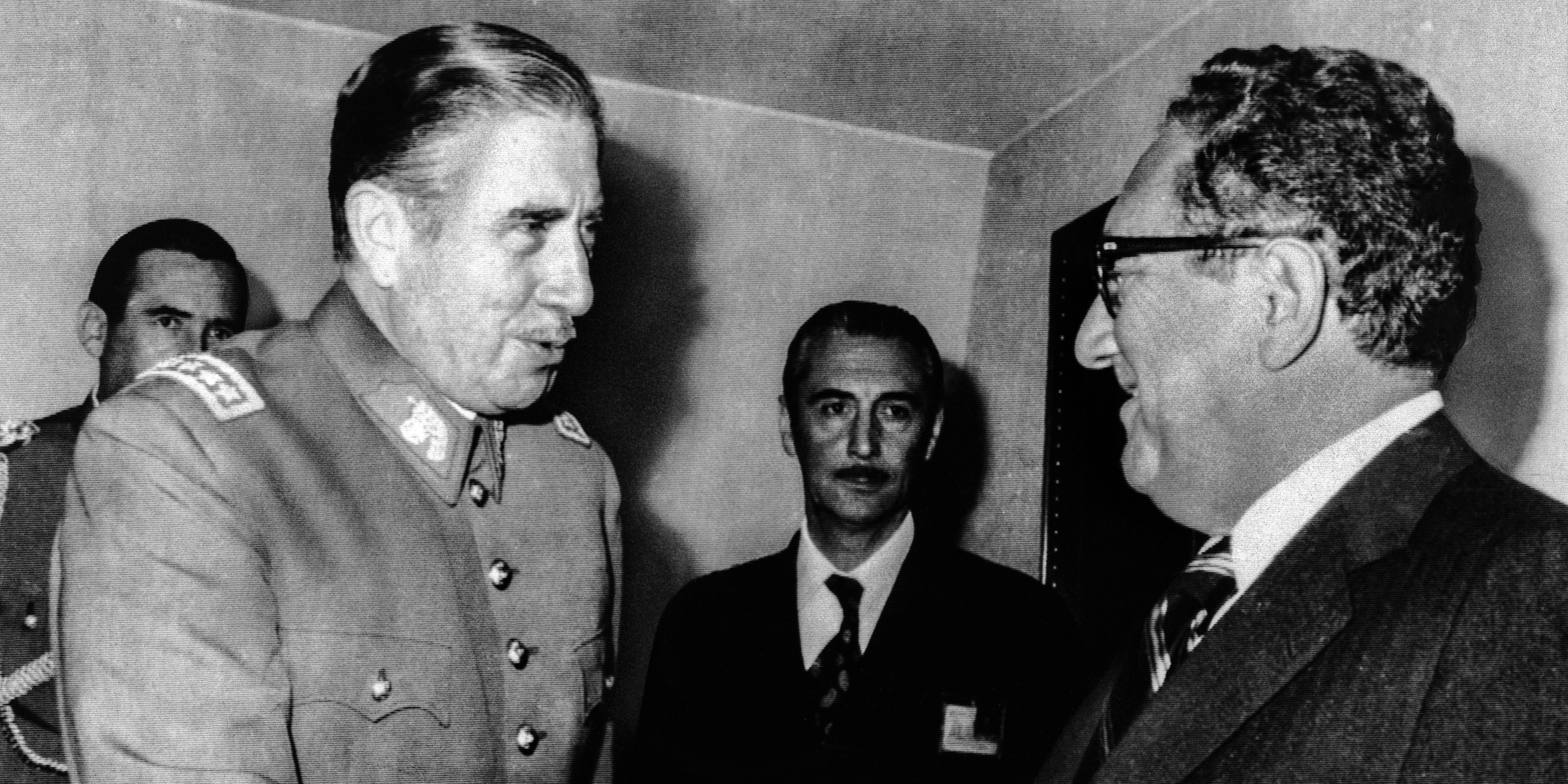 Chilean President Augusto Pinochet greets Secretary of State Harry Kissinger on his arrival at the President's office. Kissinger took up the issue of the Human Rights Commission which has raised objections to Chilean abuses of civil liberties, but stopped short of taking any direct American action against Chile in the Organization of American States meeting here.